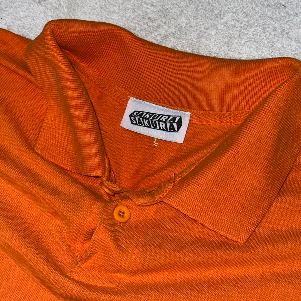 SMOKING CAUSES SWAG Polo Shirt Orange